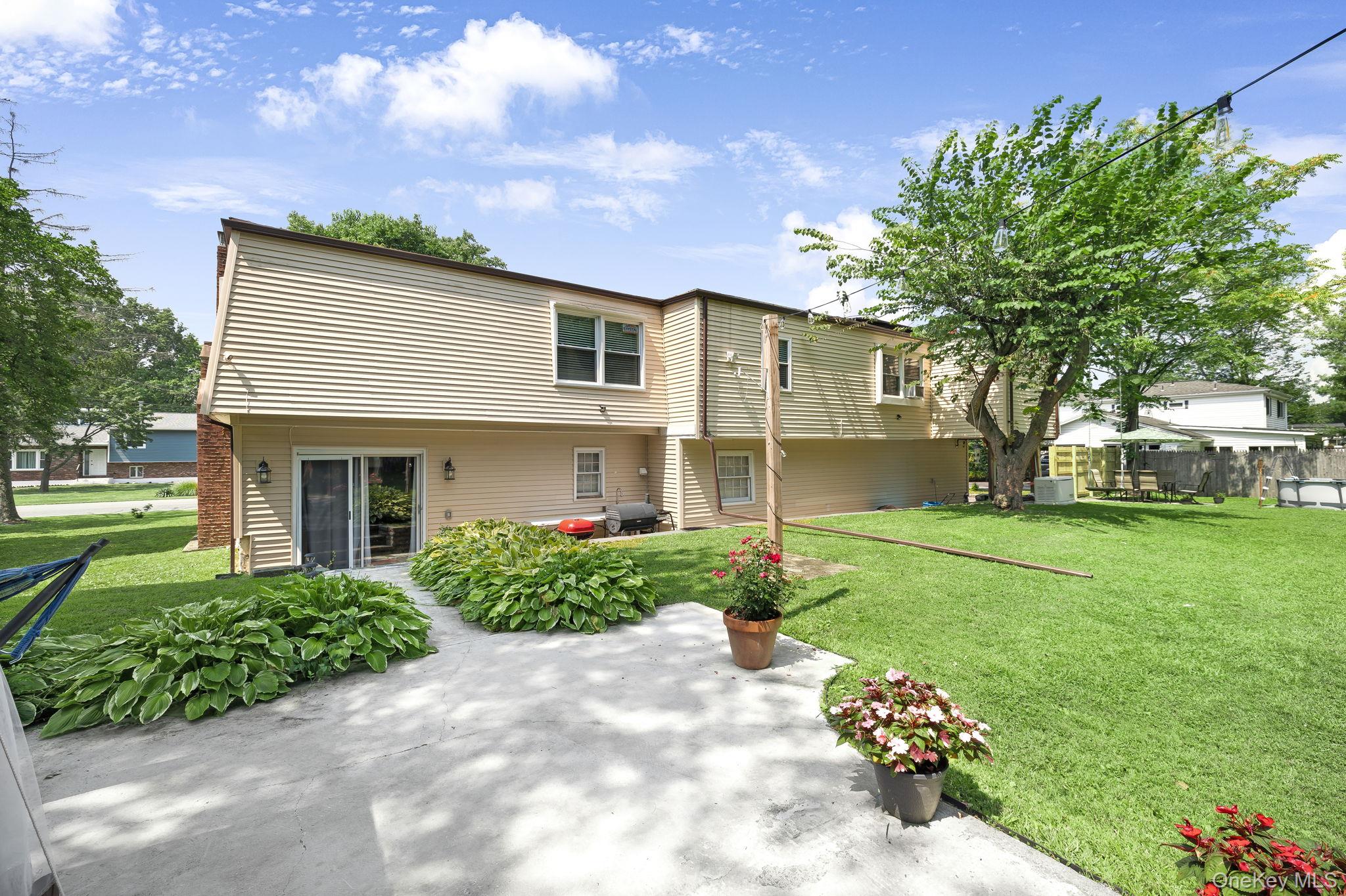 6 Farmstead Road New Windsor, NY 12553 - Photo 4 of 32 Rear view of house featuring a lawn