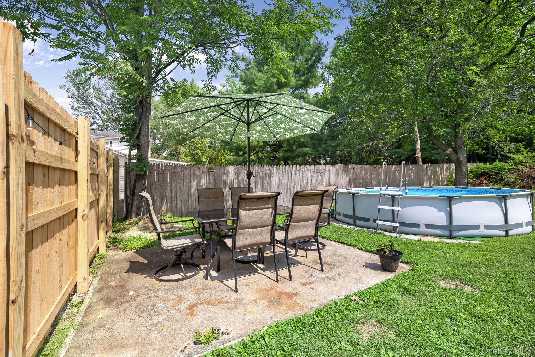 6 Farmstead Road New Windsor, NY 12553 - Photo 6 of 32 Fenced backyard with a patio area and outdoor dining area