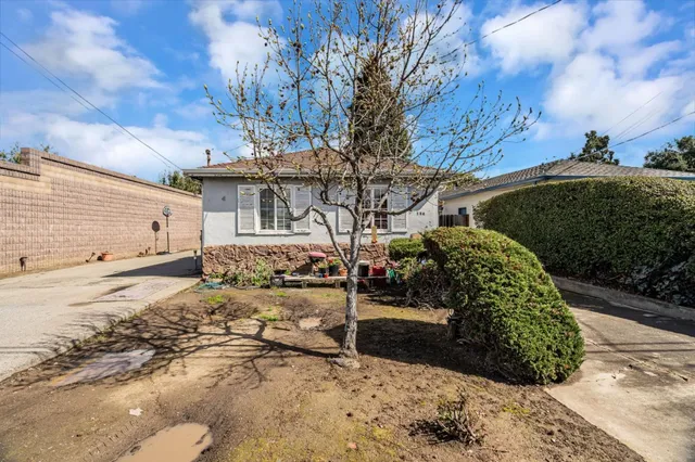 a view of a backyard of the house