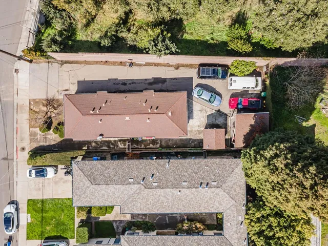 an aerial view of multiple house with outdoor space