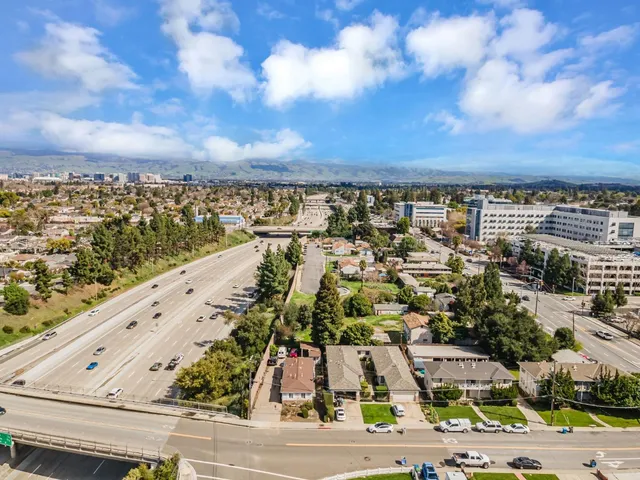 an aerial view of a house with a yard