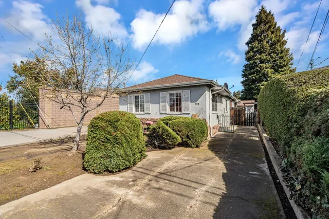 a view of a backyard with sitting area