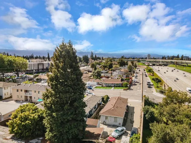 a view of multiple houses with a yard
