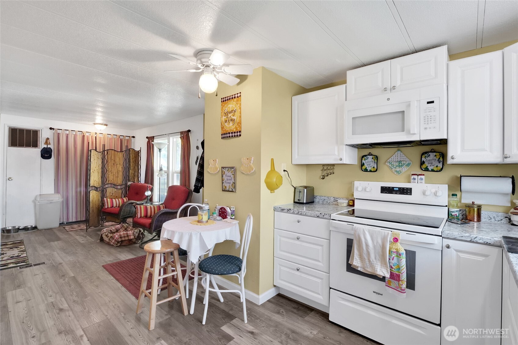 9630 Rd H.8 Northeast Moses Lake, WA 98837 - Photo 15 of 39 a kitchen filled with white cabinets and white appliances