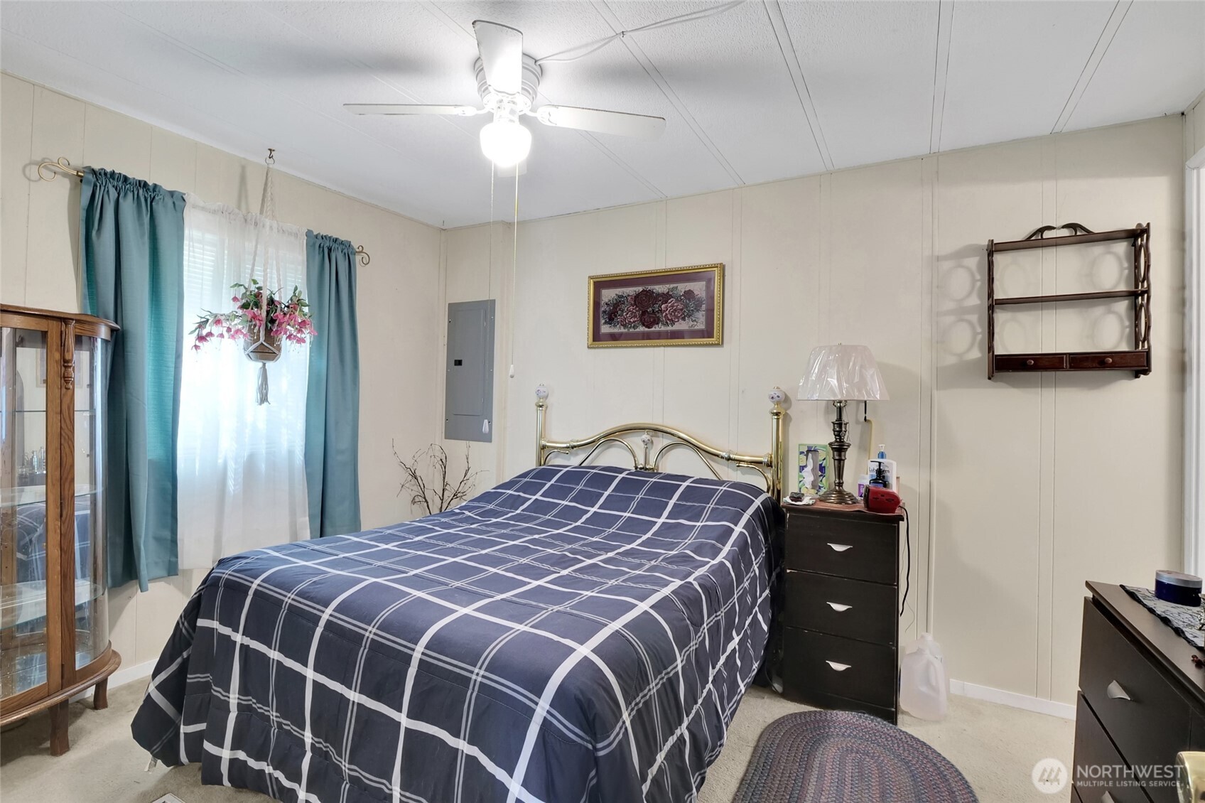 9630 Rd H.8 Northeast Moses Lake, WA 98837 - Photo 18 of 39 a bedroom with a bed and a chandelier