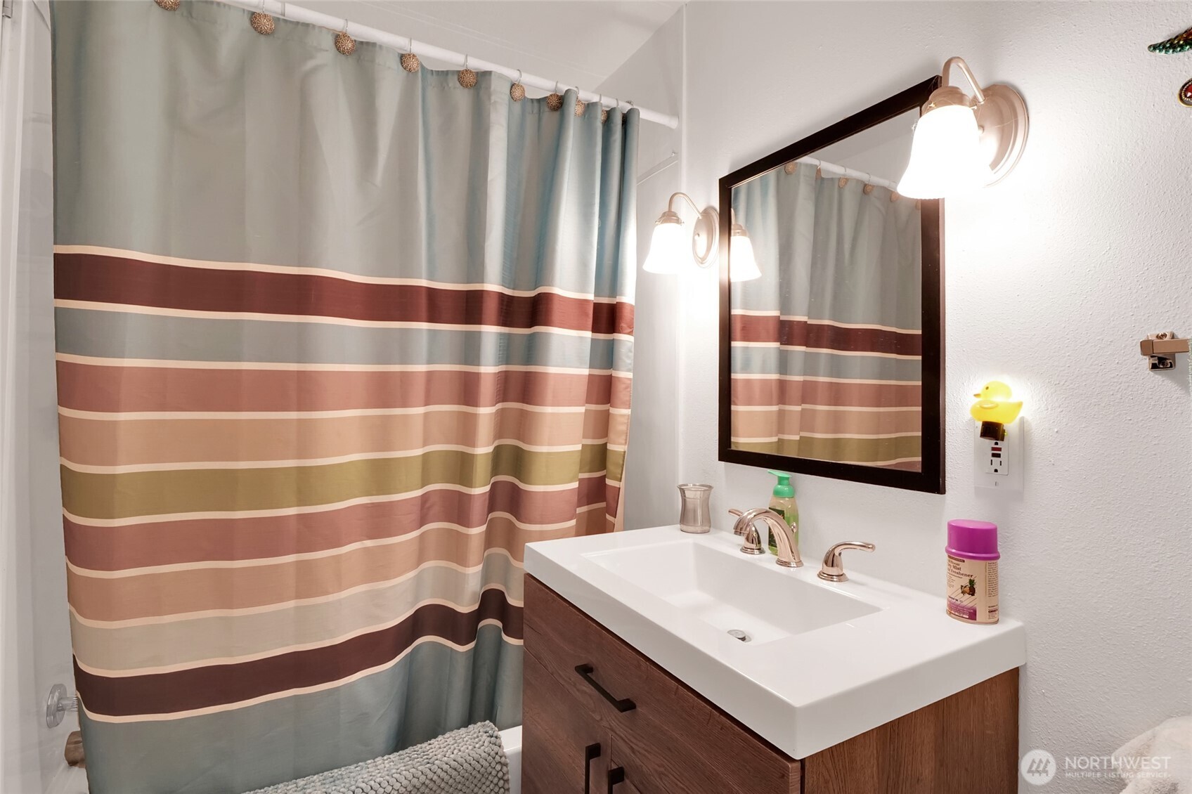 9630 Rd H.8 Northeast Moses Lake, WA 98837 - Photo 24 of 39 a bathroom with a sink and a mirror