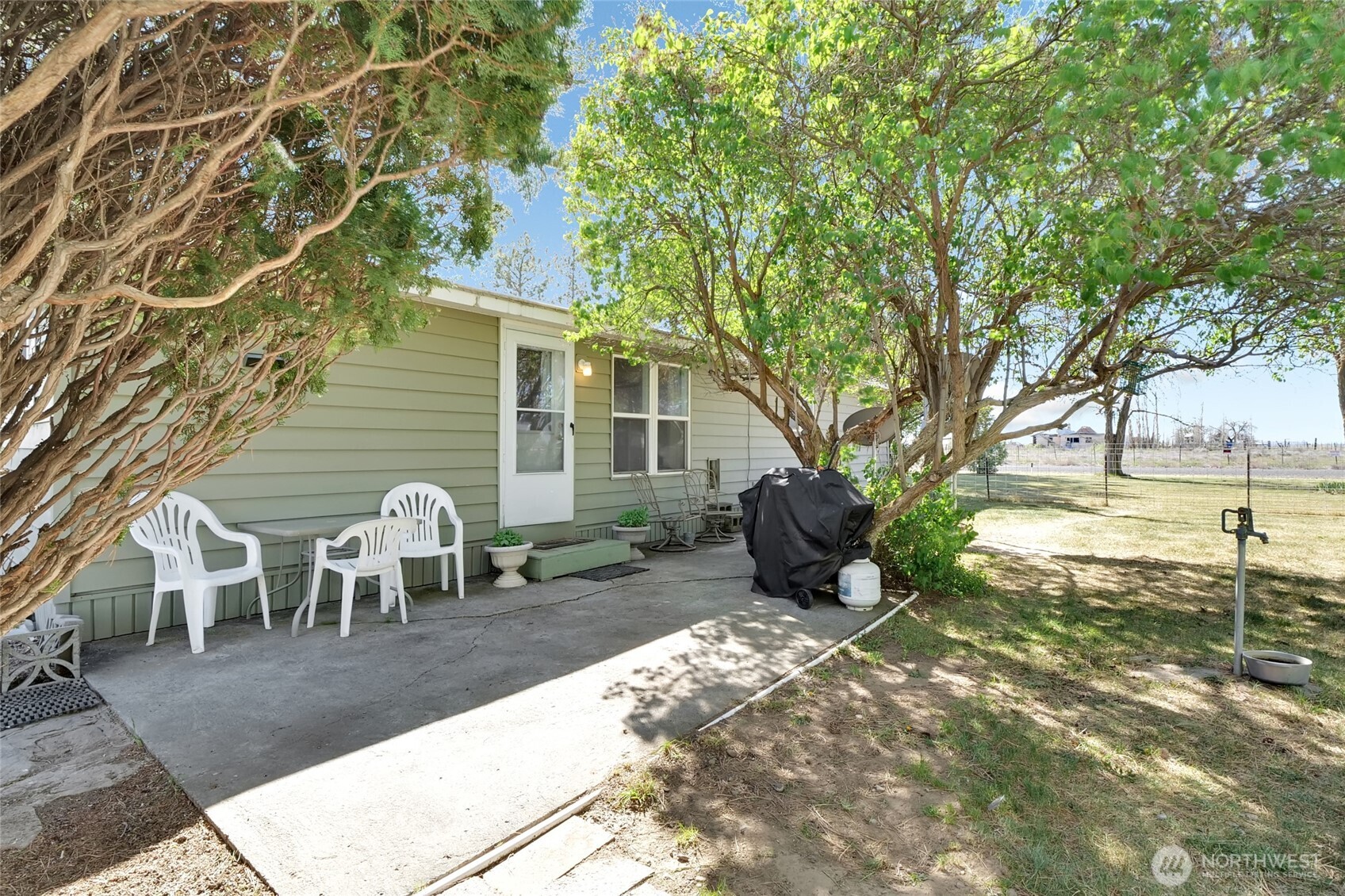 9630 Rd H.8 Northeast Moses Lake, WA 98837 - Photo 27 of 39 a view of a house with backyard porch and sitting area