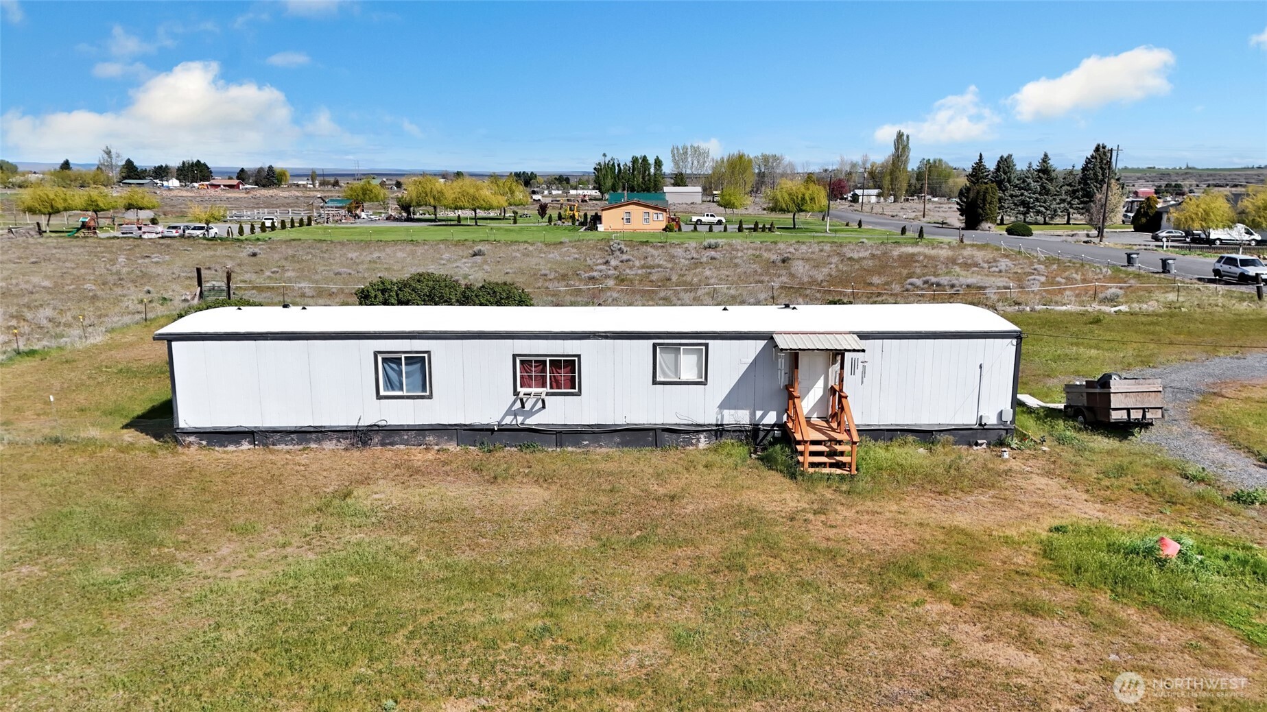 9630 Rd H.8 Northeast Moses Lake, WA 98837 - Photo 34 of 39 a view of a big yard with a table and chairs
