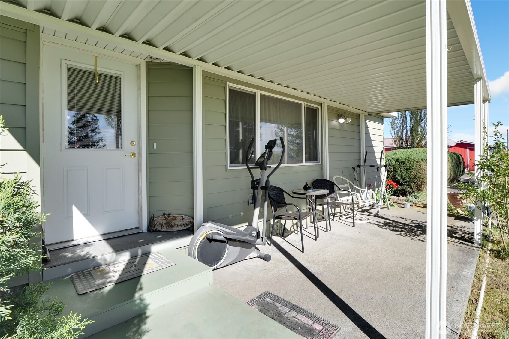 9630 Rd H.8 Northeast Moses Lake, WA 98837 - Photo 5 of 39 a view of a patio with table and chairs and potted plants