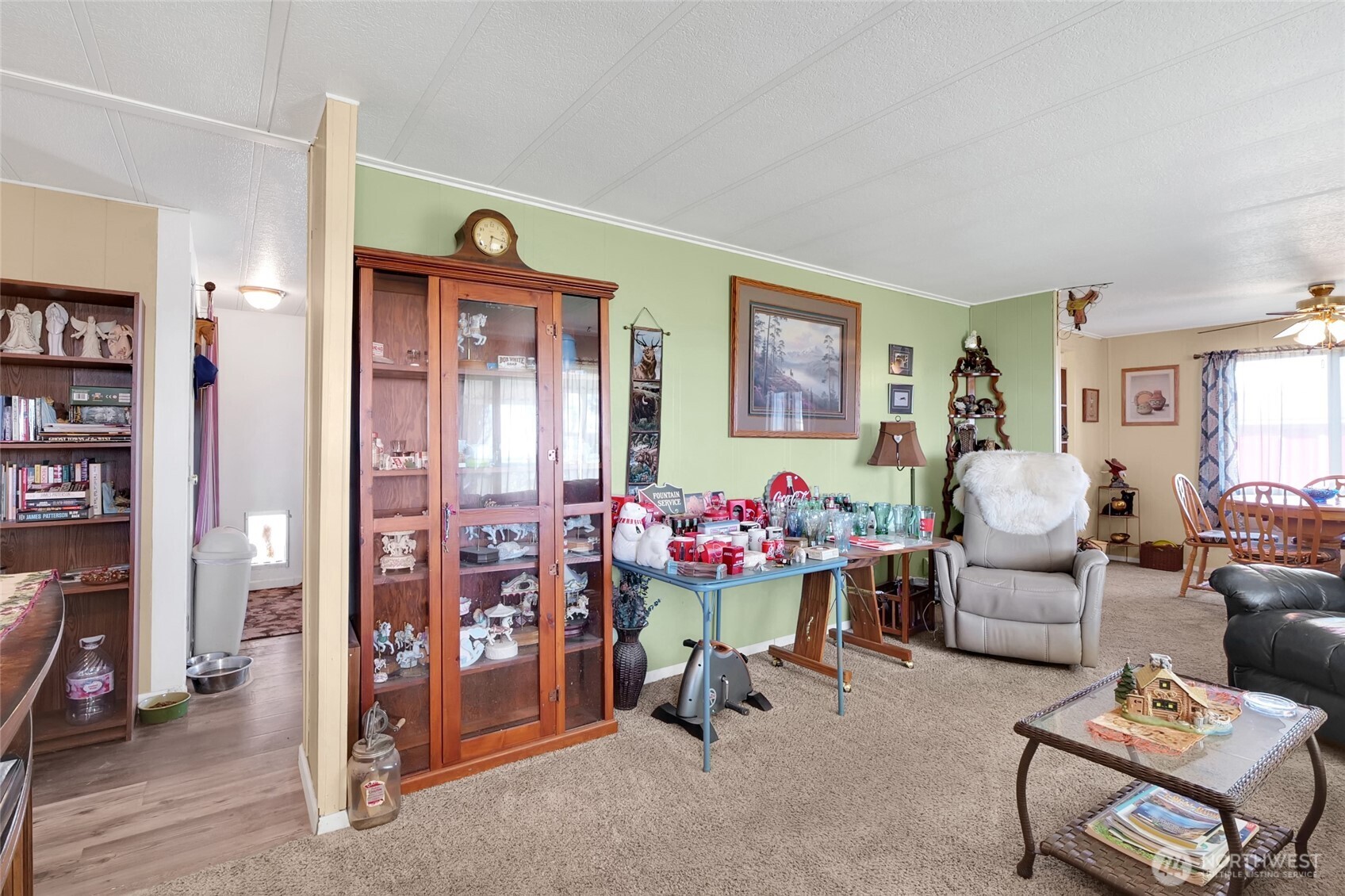 9630 Rd H.8 Northeast Moses Lake, WA 98837 - Photo 6 of 39 a living room with furniture a bookshelf and a window