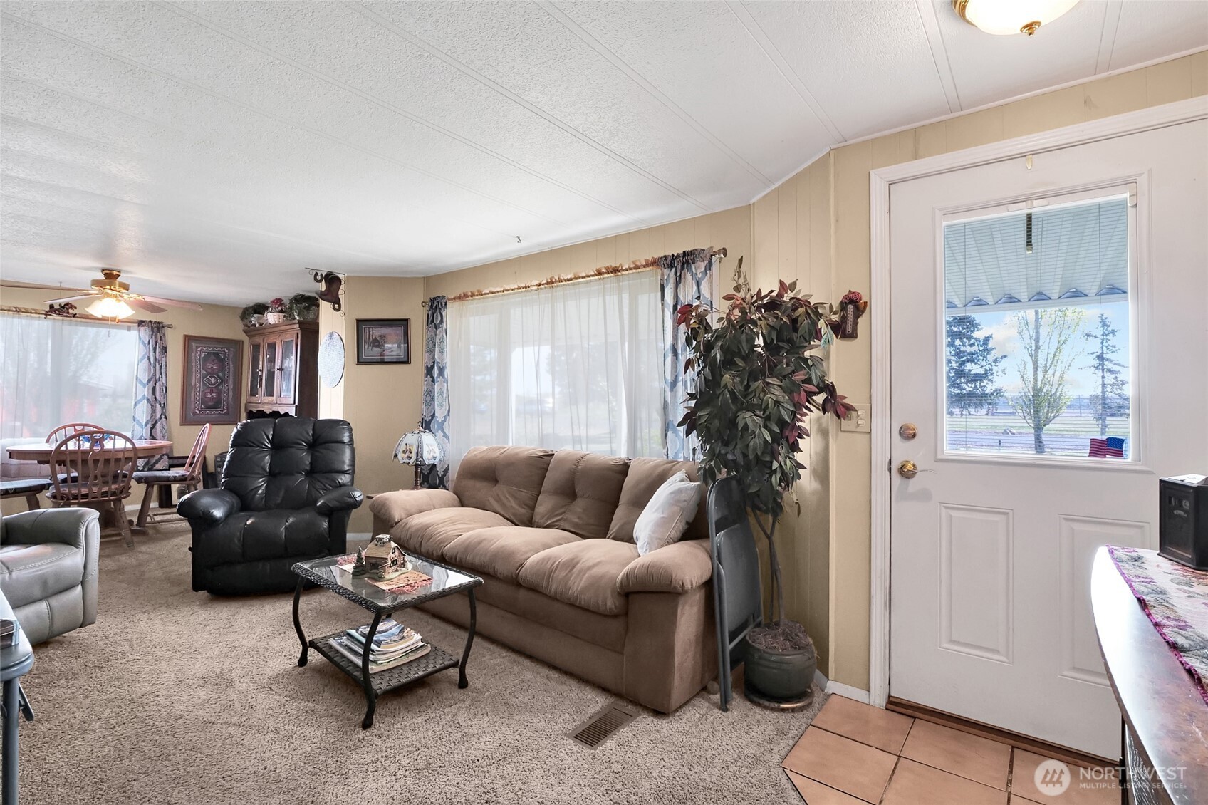 9630 Rd H.8 Northeast Moses Lake, WA 98837 - Photo 7 of 39 a living room with furniture a window and a potted plant