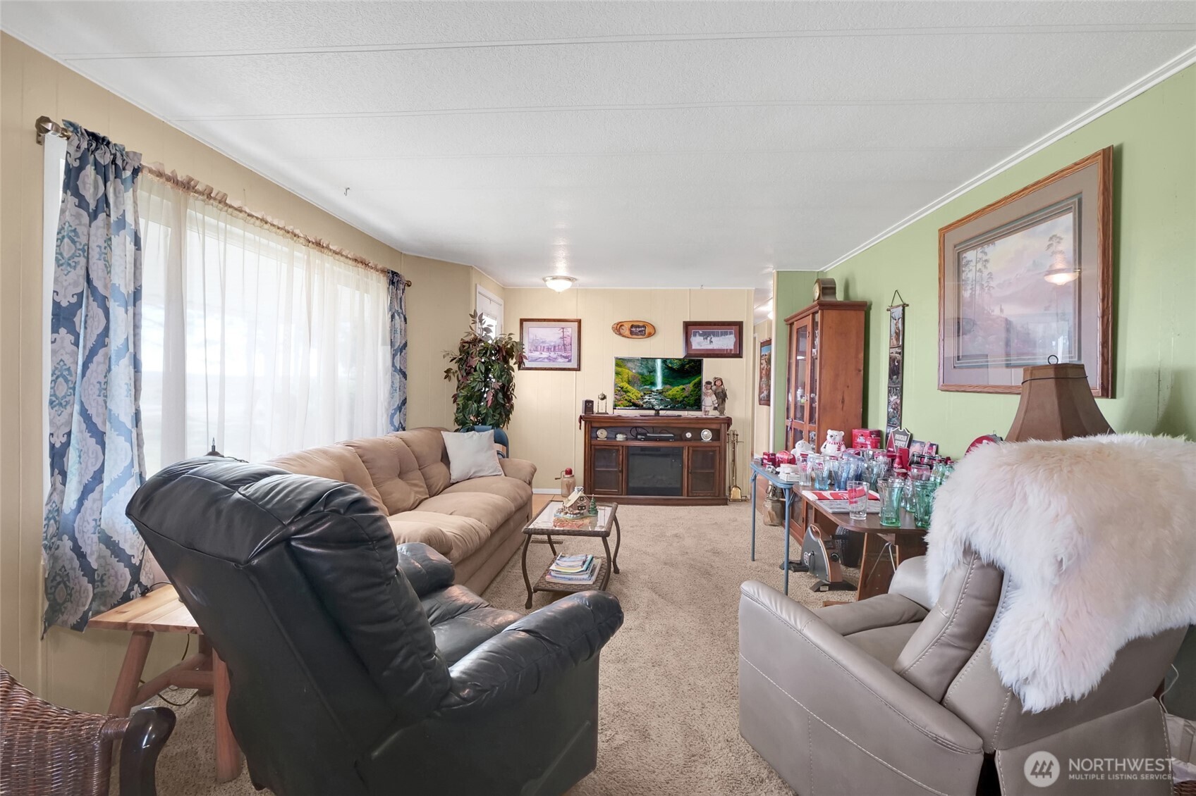 9630 Rd H.8 Northeast Moses Lake, WA 98837 - Photo 8 of 39 a living room with furniture and a large window