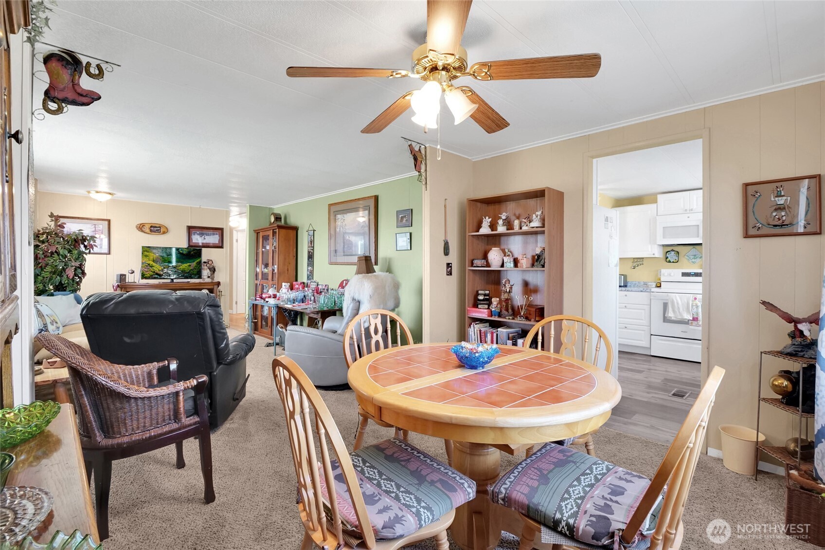 9630 Rd H.8 Northeast Moses Lake, WA 98837 - Photo 10 of 39 a dining room with furniture a rug and wooden floor