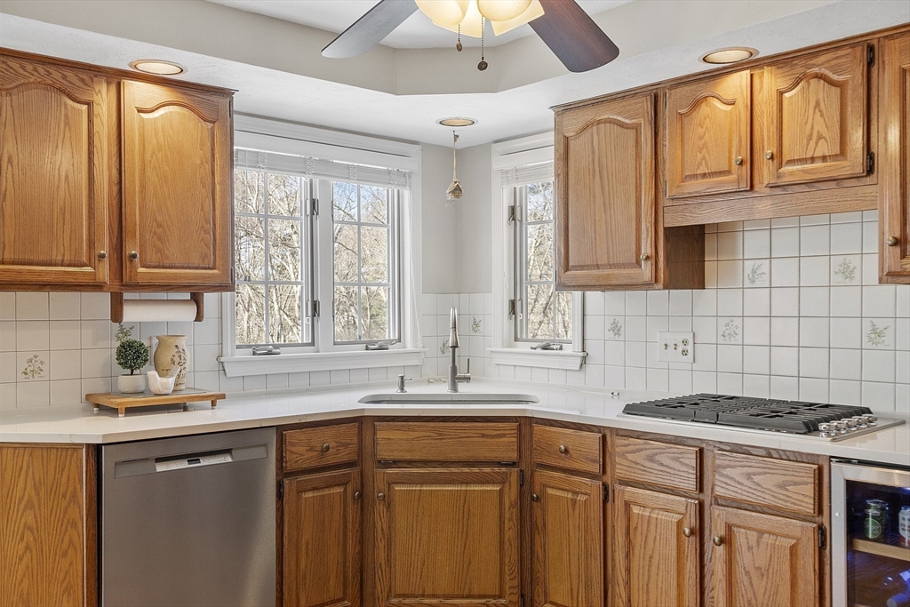 2 Abigail Drive Hudson, MA 01749 - Photo 12 of 42 a kitchen with stainless steel appliances granite countertop a sink a stove and a microwave