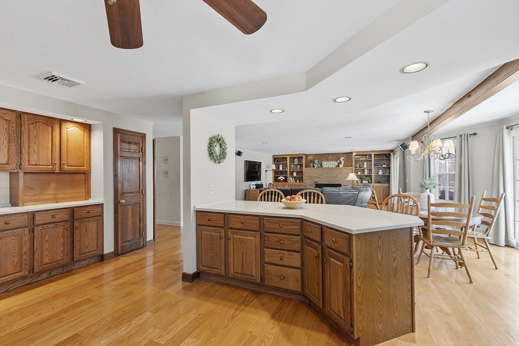 2 Abigail Drive Hudson, MA 01749 - Photo 14 of 42 a large kitchen with kitchen island white cabinets and stainless steel appliances