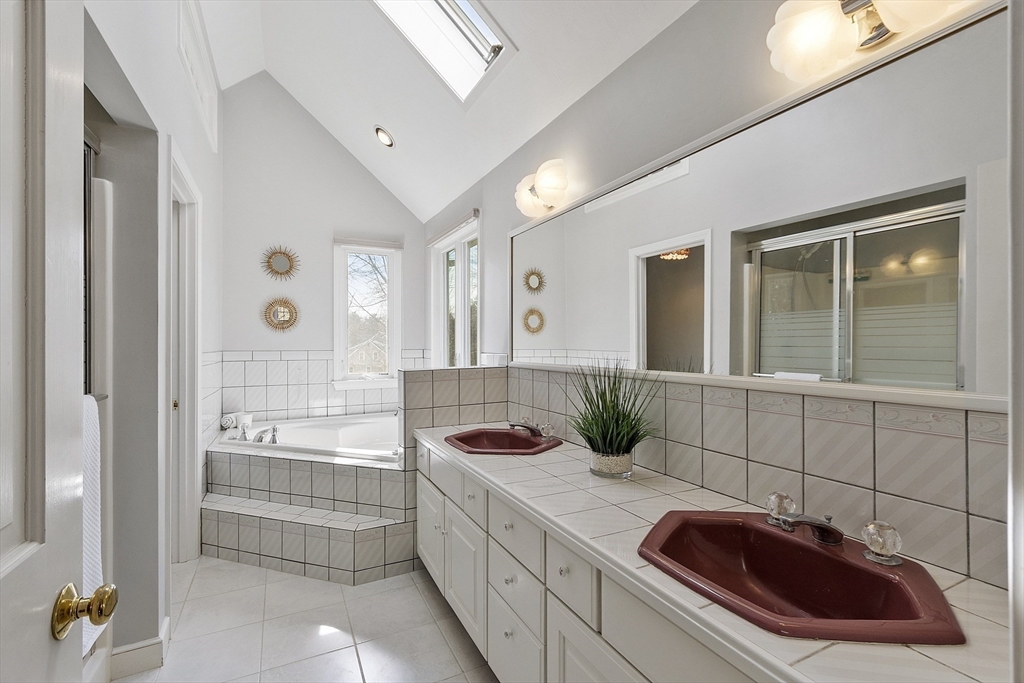 2 Abigail Drive Hudson, MA 01749 - Photo 26 of 42 a bathroom with a tub sink and mirror