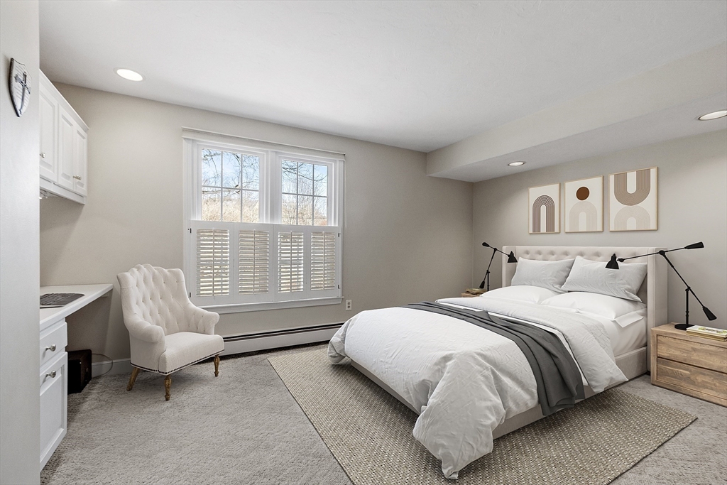 2 Abigail Drive Hudson, MA 01749 - Photo 28 of 42 a spacious bedroom with a bed and a couch