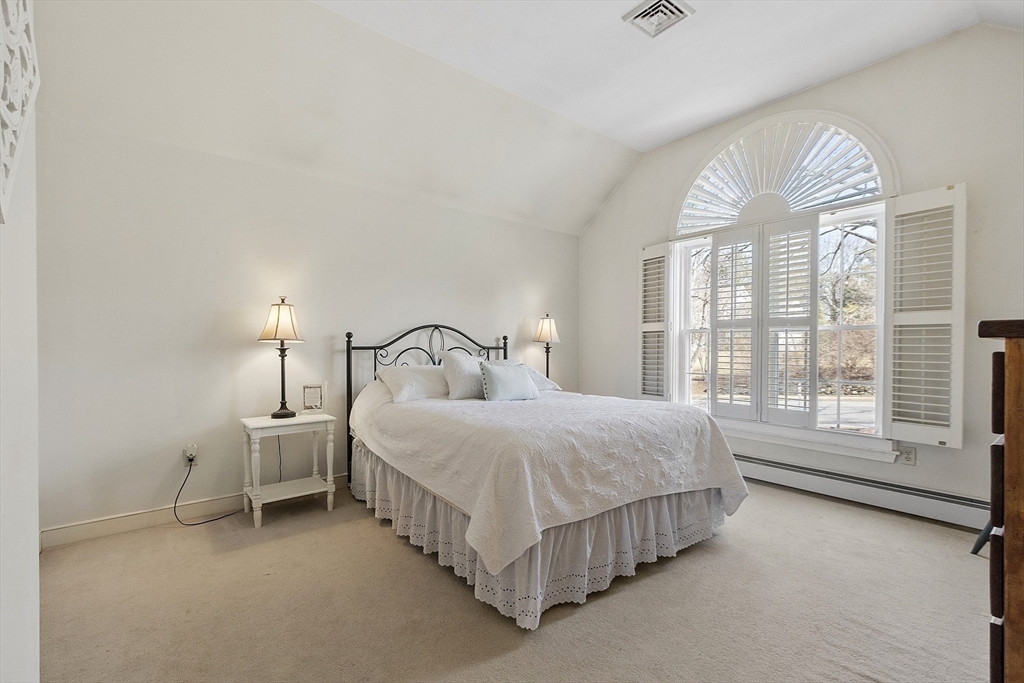 2 Abigail Drive Hudson, MA 01749 - Photo 29 of 42 a spacious bedroom with a bed and a large window