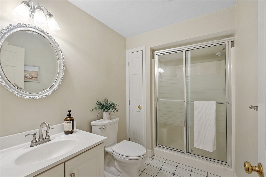 2 Abigail Drive Hudson, MA 01749 - Photo 30 of 42 a bathroom with a sink a toilet and a mirror