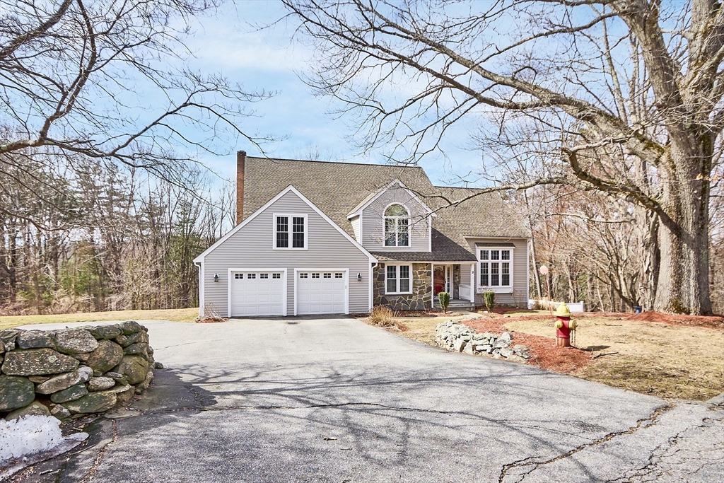 2 Abigail Drive Hudson, MA 01749 - Photo 3 of 42 a front view of a house with a yard