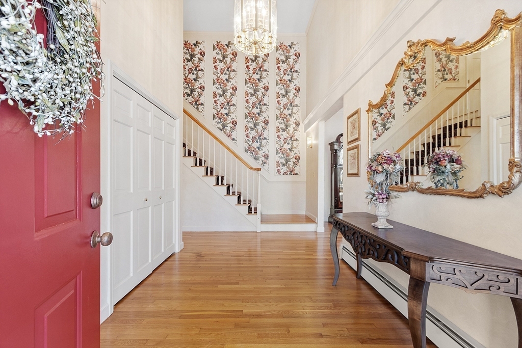 2 Abigail Drive Hudson, MA 01749 - Photo 5 of 42 a view of entryway and hall with wooden floor