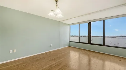 a view of an empty room with a window
