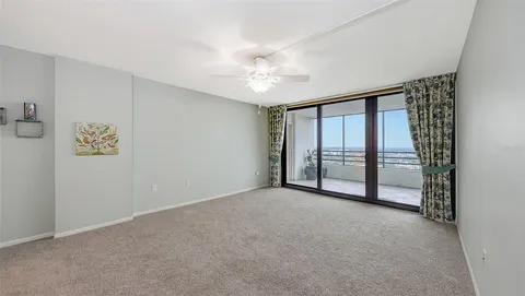 a view of an empty room with a window