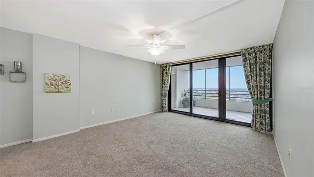 a view of an empty room with a window