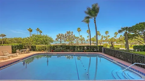 a view of a swimming pool with a deck