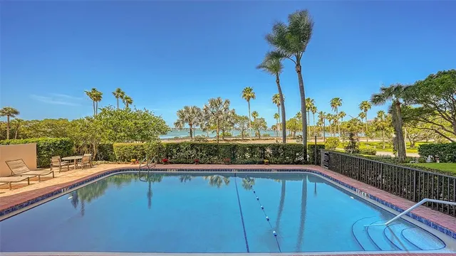 a view of a swimming pool with a deck