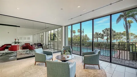 a living room with furniture and a bed