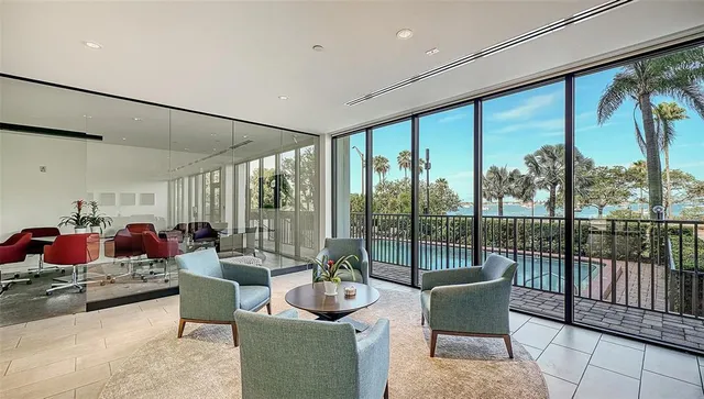 a living room with furniture and a bed