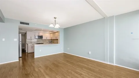 a view of kitchen with wooden floor