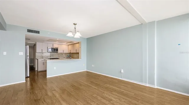 a view of kitchen with wooden floor