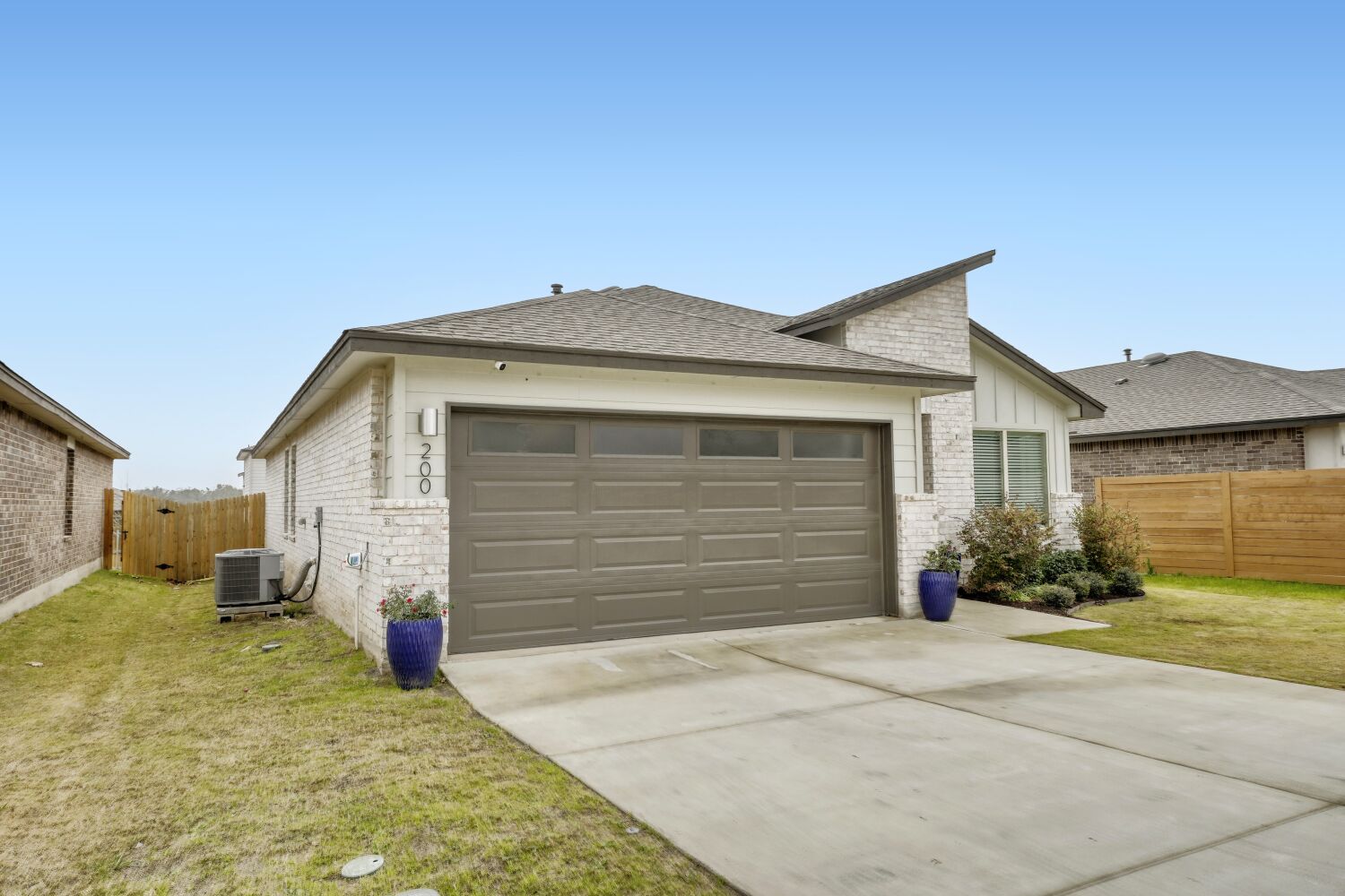 200 Coda Crossing Georgetown, TX 78633 - Photo 27 of 29 a front view of a house with a yard and garage