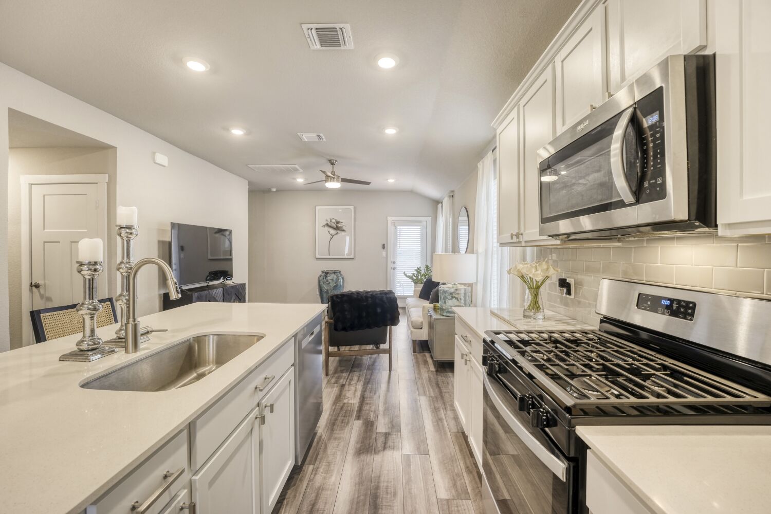 200 Coda Crossing Georgetown, TX 78633 - Photo 5 of 29 a kitchen with stainless steel appliances granite countertop a sink stove and refrigerator