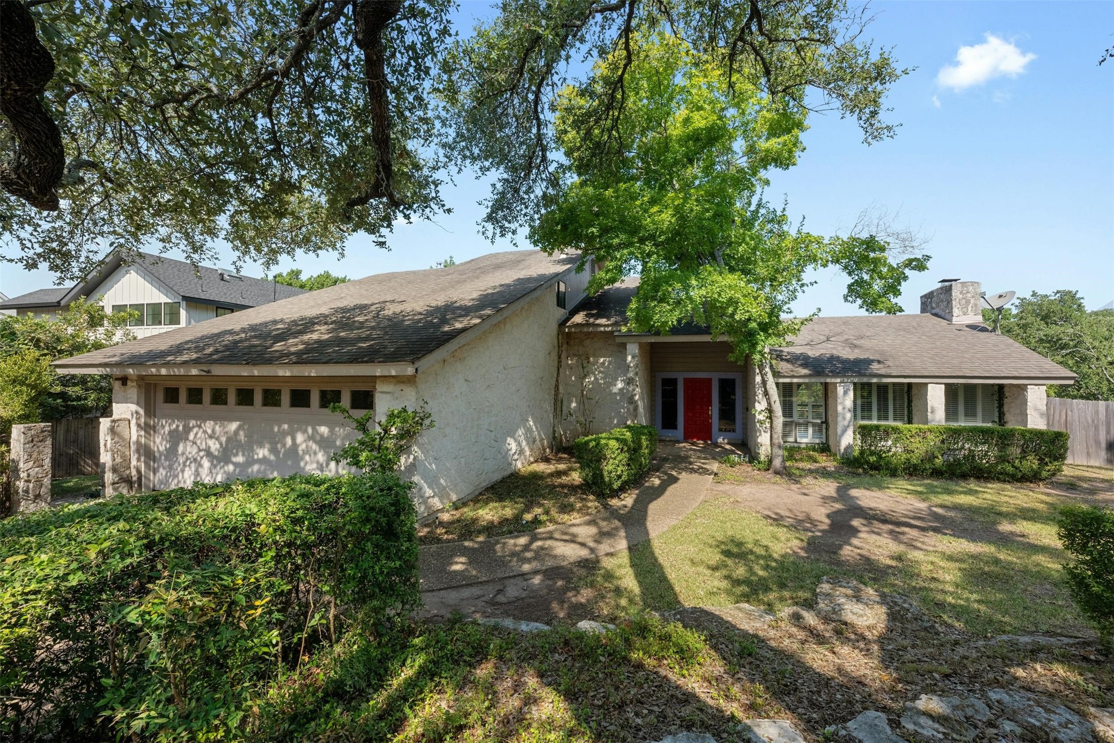 a view of a house with a chairs in a patio