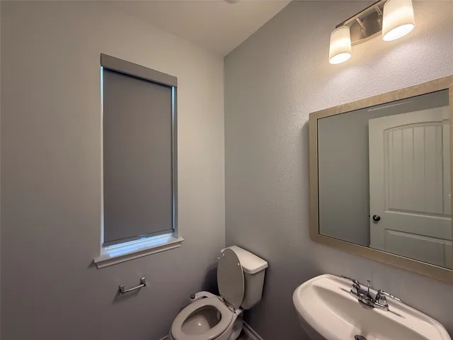 a view of hallway with windows