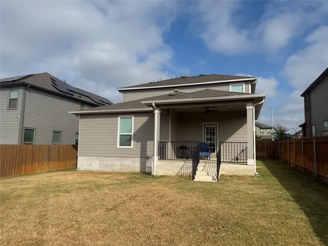 a view of house with back yard