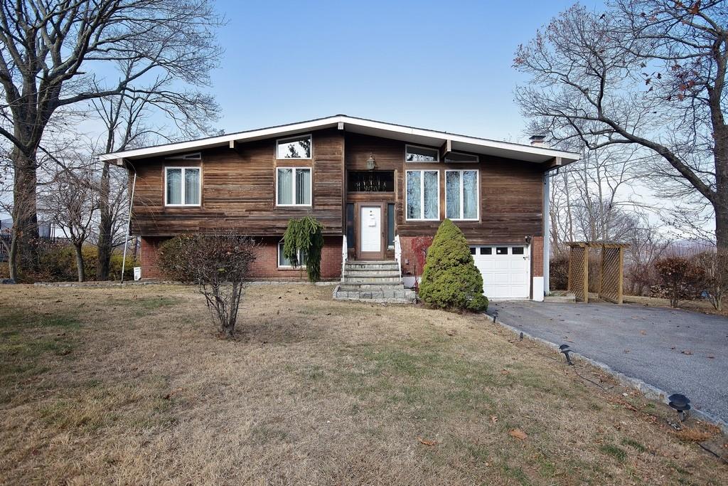 39 Kings Ridge Road Mahopac, NY 10541 - Photo 1 of 1 a front view of a house with a yard and garage