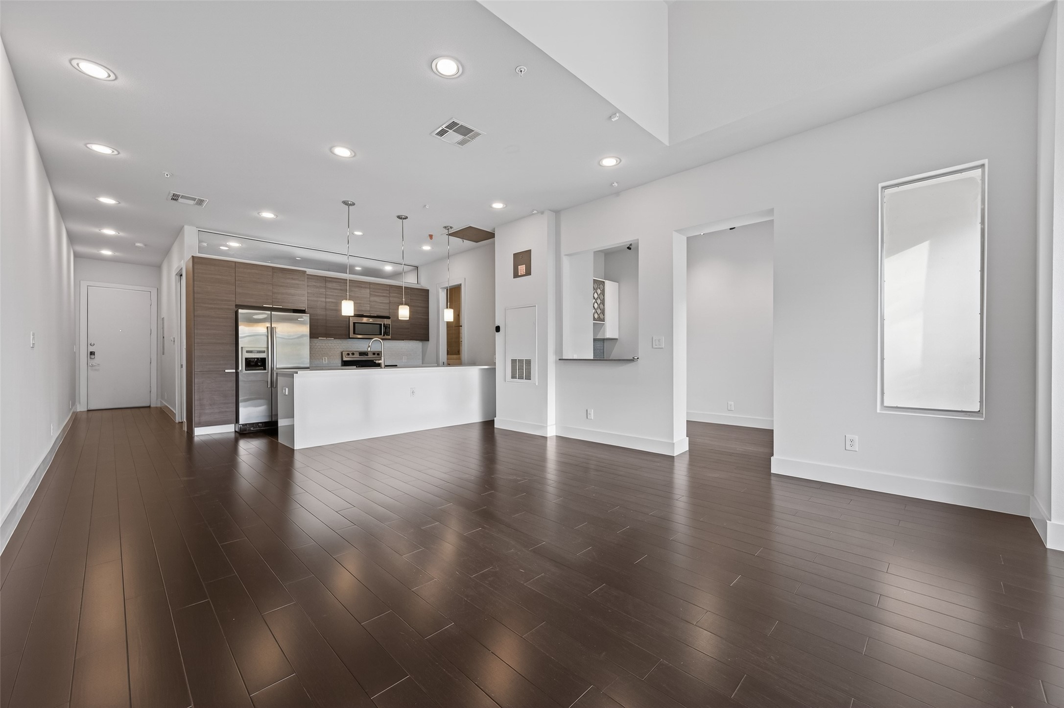 207 Pierce Street, Unit 307 Houston, TX 77002 - Photo 5 of 33 Gleaming dark bamboo floors!