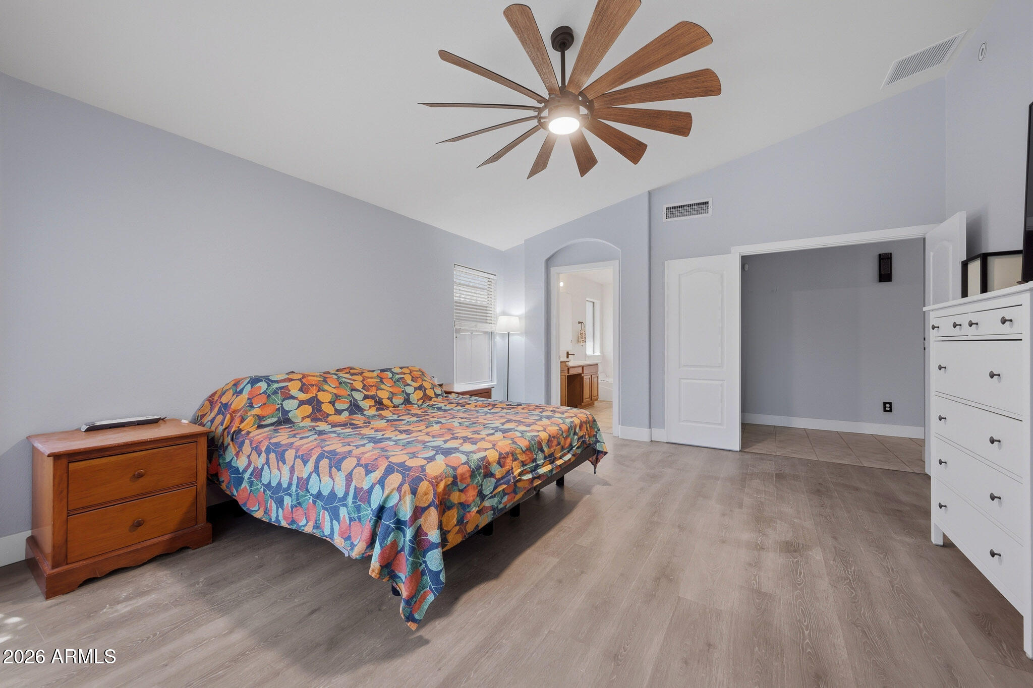 2153 East Kempton Road Chandler, AZ 85225 - Photo 38 of 50 a bedroom with a bed and a chandelier