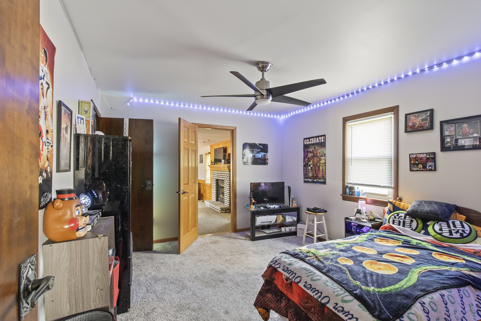 812 West 3rd Street Gilman, IL 60938 - Photo 11 of 19 a bedroom that has a bed and a tv in it