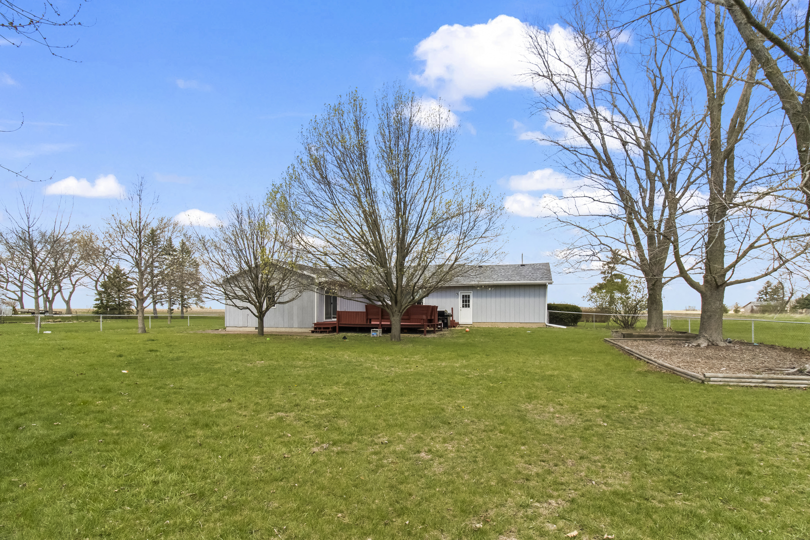 812 West 3rd Street Gilman, IL 60938 - Photo 19 of 19 a view of a house with a yard