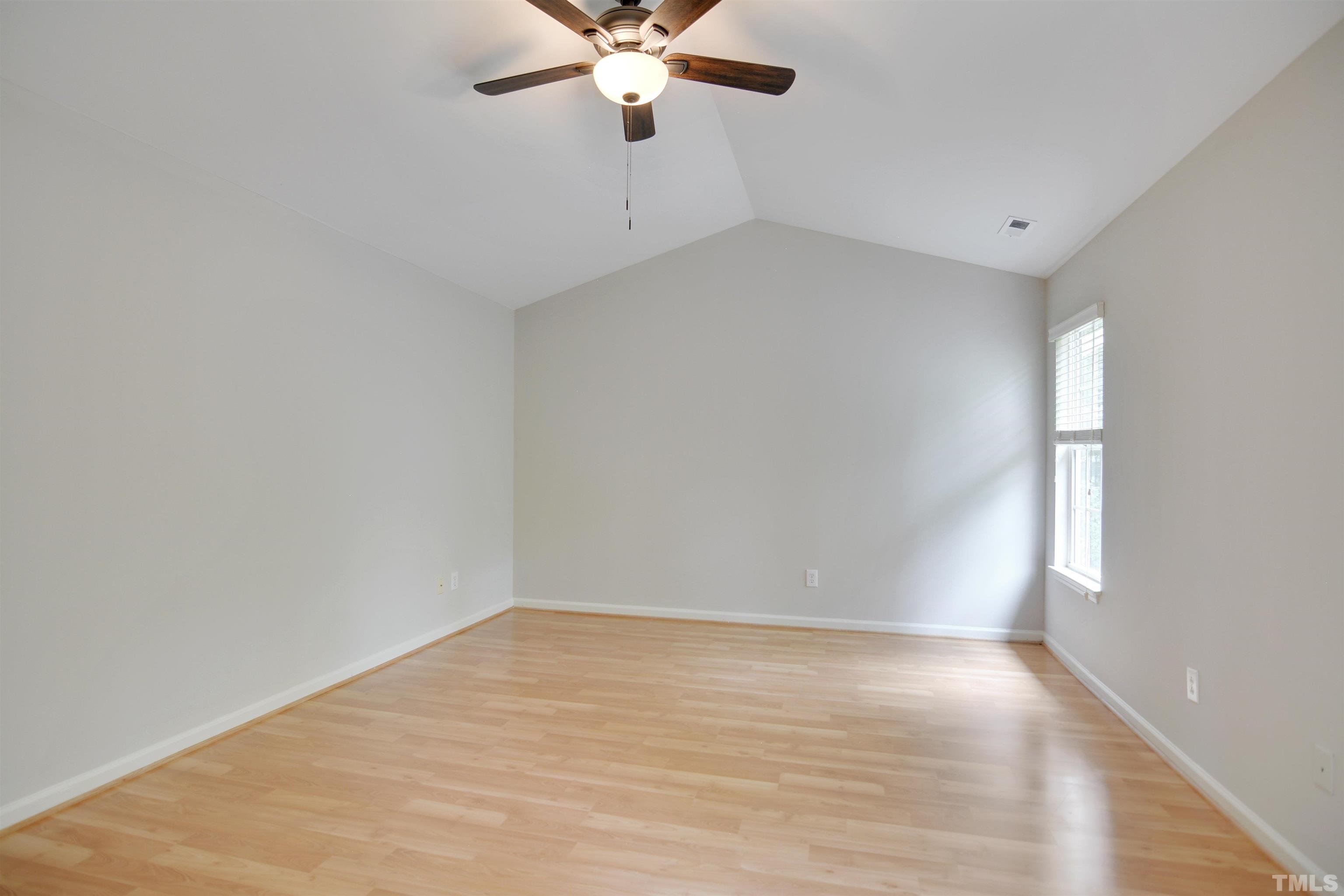 8400 Astwell Court Raleigh, NC 27615 - Photo 11 of 21 wooden floor in an empty room with a window