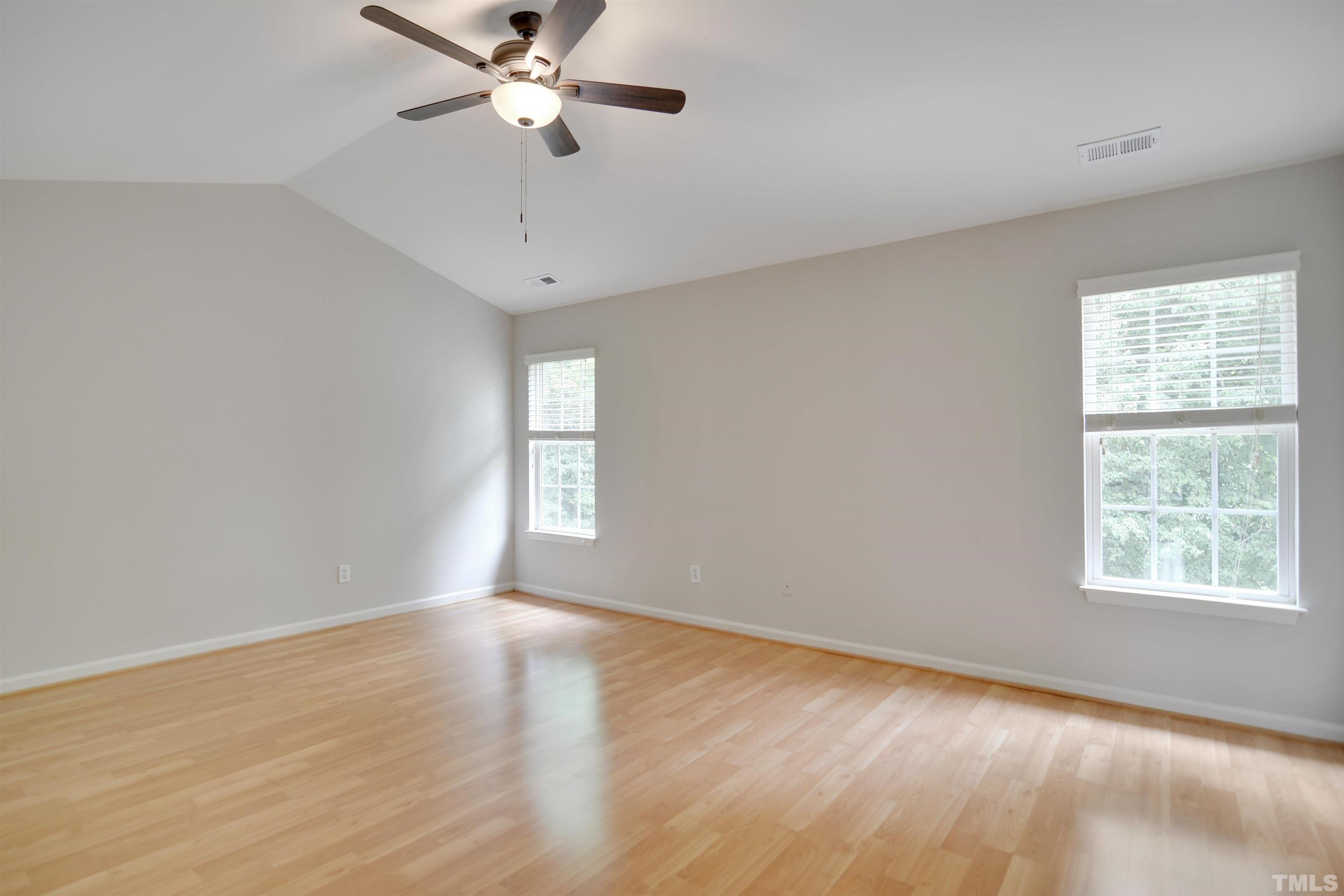 8400 Astwell Court Raleigh, NC 27615 - Photo 12 of 21 wooden floor in an empty room with a window