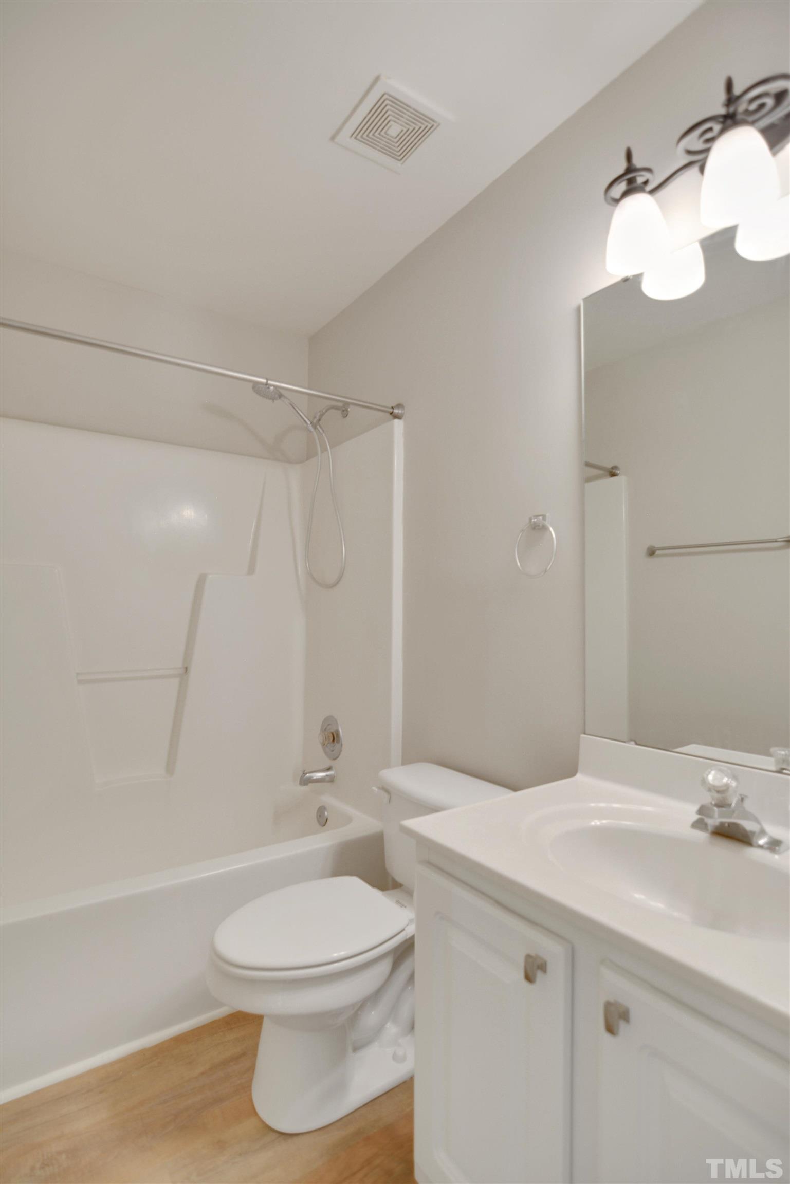 8400 Astwell Court Raleigh, NC 27615 - Photo 17 of 21 a bathroom with a sink a toilet and shower