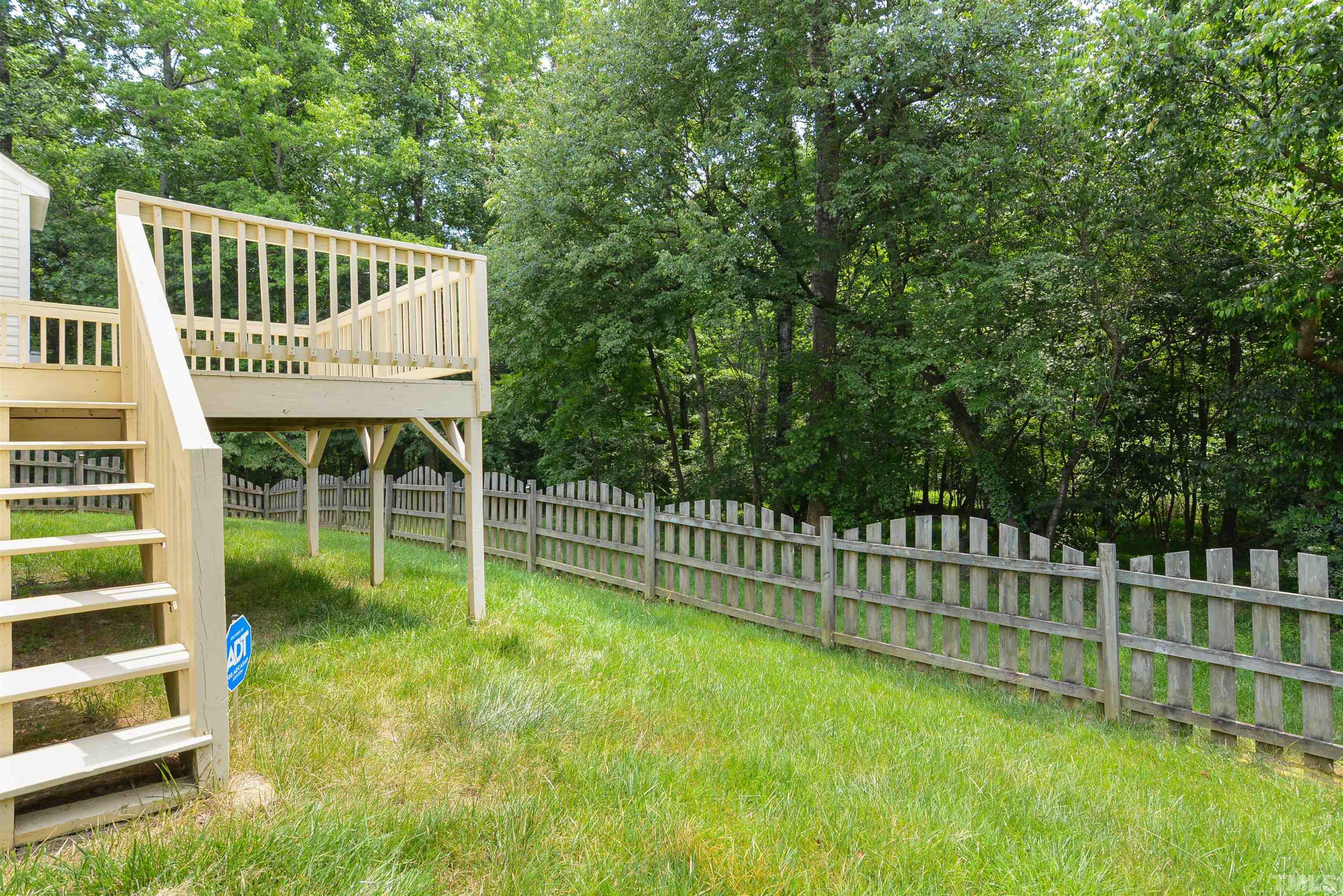 8400 Astwell Court Raleigh, NC 27615 - Photo 20 of 21 a view of a deck with a backyard