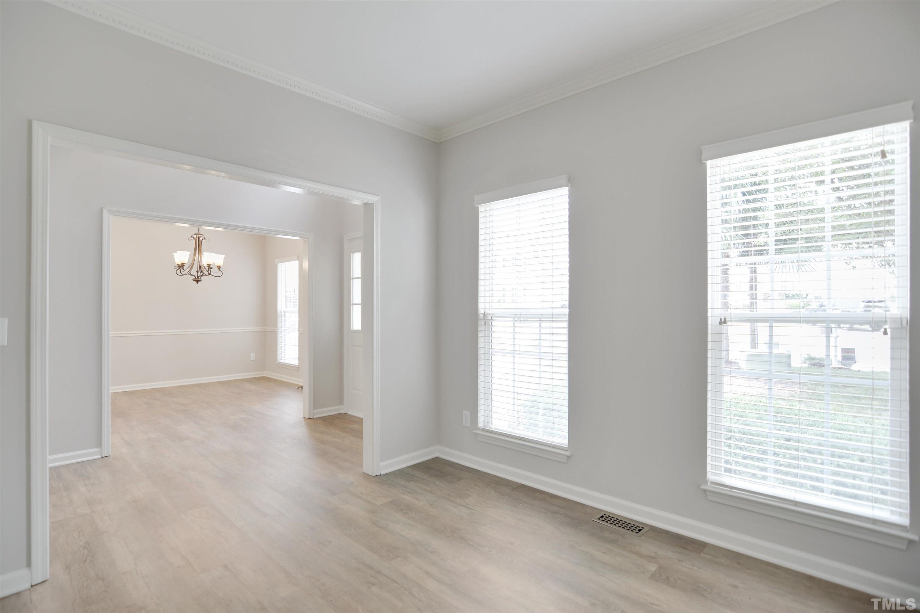8400 Astwell Court Raleigh, NC 27615 - Photo 4 of 21 a view of an empty room with a window