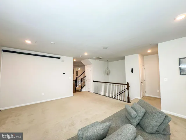 a bed room with furniture and a ceiling fan